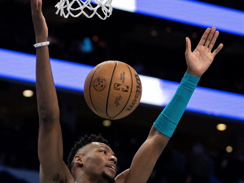 CHARLOTTE, NORTH CAROLINA - APRIL 05: Brandon Miller #24 of the Charlotte Hornets reacts after dunking the ball in the first quarter during their game against the Orlando Magic at Spectrum Center on April 05, 2024 in Charlotte, North Carolina. NOTE TO USER: User expressly acknowledges and agrees that, by downloading and or using this photograph, User is consenting to the terms and conditions of the Getty Images License Agreement. (Photo by Jacob Kupferman/Getty Images)