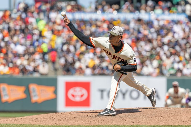 May 18, 2025; San Francisco, California, USA; San Francisco Giants pitcher Randy Rodríguez (73) throws a pitch during the eighth inning against the Oakland Athletics at Oracle Park. Mandatory Credit: Bob Kupbens-Imagn Images