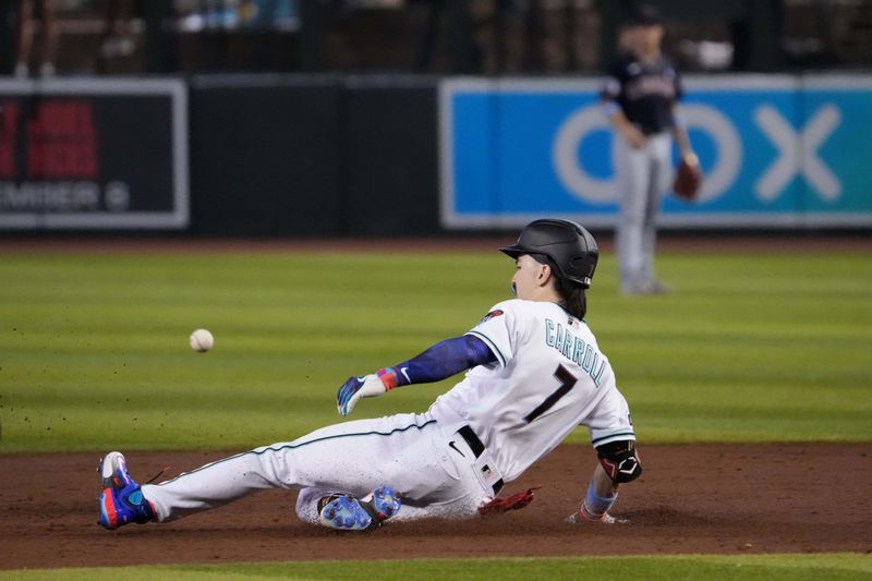 Jun 18, 2023; Phoenix, Arizona, USA; Arizona Diamondbacks center fielder Corbin Carroll (7) beats a throw to second base for a double during the third inning against the Cleveland Guardians at Chase Field. Mandatory Credit: Joe Camporeale-USA TODAY Sports