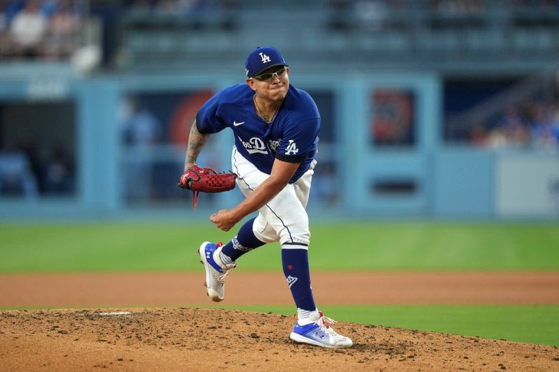 Jul 25, 2023; Los Angeles, California, USA; Los Angeles Dodgers starting pitcher Julio Urias (7) throws in the third inning against the Toronto Blue Jays at Dodger Stadium. Mandatory Credit: Kirby Lee-USA TODAY Sports