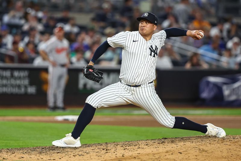 Jun 19, 2024; Bronx, New York, USA;  New York Yankees pitcher Victor González (47) pitches in the seventh inning against the Baltimore Orioles at Yankee Stadium. Mandatory Credit: Wendell Cruz-USA TODAY Sports