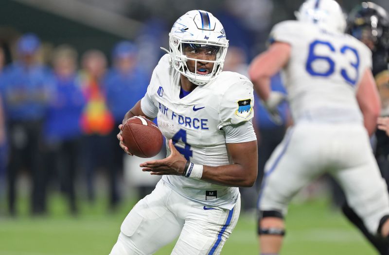 Nov 5, 2022; Arlington, Texas, USA; Air Force Falcons quarterback Haaziq Daniels (4) carries the ball against the Army Black Knights during the second half at the Commanders    Classic at Globe Life Field. Mandatory Credit: Danny Wild-USA TODAY Sports