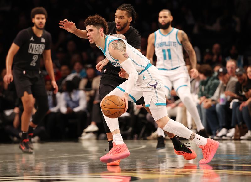 NEW YORK, NEW YORK - NOVEMBER 19:  LaMelo Ball #1 of the Charlotte Hornets in action against the Brooklyn Nets during their game at Barclays Center on November 19, 2024 in New York City.   User expressly acknowledges and agrees that, by downloading and or using this photograph, User is consenting to the terms and conditions of the Getty Images License Agreement.  (Photo by Al Bello/Getty Images)