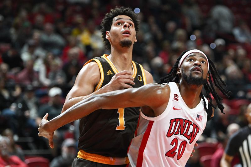 Feb 3, 2024; Las Vegas, Nevada, USA; UNLV Rebels forward Keylan Boone (20) boxes out Wyoming Cowboys guard Brendan Wenzel (1) in the second half at Thomas & Mack Center. Mandatory Credit: Candice Ward-USA TODAY Sports