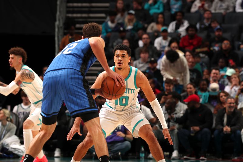 CHARLOTTE, NC - NOVEMBER 25:  Josh Green #10 of the Charlotte Hornets plays defense during the game against the Orlando Magic during a regular season game on November 25, 2024 at Spectrum Center in Charlotte, North Carolina. NOTE TO USER: User expressly acknowledges and agrees that, by downloading and or using this photograph, User is consenting to the terms and conditions of the Getty Images License Agreement. Mandatory Copyright Notice: Copyright 2024 NBAE (Photo by Kent Smith/NBAE via Getty Images)