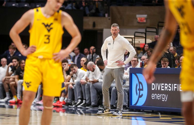 Feb 3, 2024; Morgantown, West Virginia, USA; West Virginia Mountaineers head coach Josh Eilert looks on late in the second half against the Brigham Young Cougars at WVU Coliseum. Mandatory Credit: Ben Queen-USA TODAY Sports