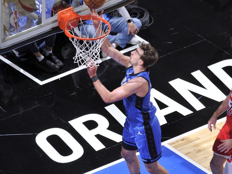 ORLANDO, FL - FEBRUARY 23:  Franz Wagner #22 of the Orlando Magic drives to the basket during the game against the Washington Wizards on February 23, 2025 at Kia Center in Orlando, Florida. NOTE TO USER: User expressly acknowledges and agrees that, by downloading and or using this photograph, User is consenting to the terms and conditions of the Getty Images License Agreement. Mandatory Copyright Notice: Copyright 2025 NBAE (Photo by Fernando Medina/NBAE via Getty Images)