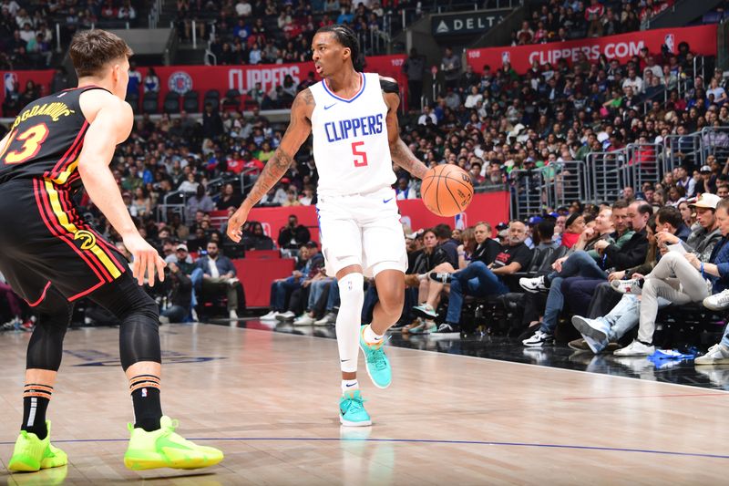 LOS ANGELES, CA - MARCH 17: Bones Hyland #5 of the LA Clippers drives to the basket during the game against the Atlanta Hawks on March 17, 2024 at Crypto.Com Arena in Los Angeles, California. NOTE TO USER: User expressly acknowledges and agrees that, by downloading and/or using this Photograph, user is consenting to the terms and conditions of the Getty Images License Agreement. Mandatory Copyright Notice: Copyright 2024 NBAE (Photo by Adam Pantozzi/NBAE via Getty Images)