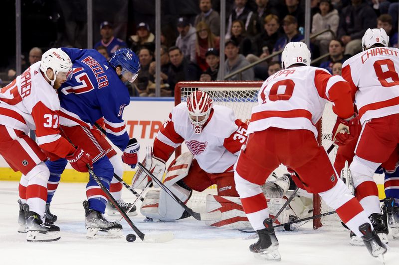 Nov 29, 2023; New York, New York, USA; Detroit Red Wings goaltender Ville Husso (35) plays the puck against New York Rangers right wing Blake Wheeler (17) in front of Red Wings left wing J.T. Compher (37) and center Andrew Copp (18) during the first period at Madison Square Garden. Mandatory Credit: Brad Penner-USA TODAY Sports