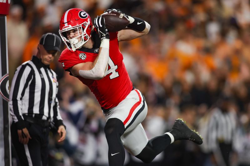 Nov 16, 2024; Athens, Georgia, USA; Georgia Bulldogs tight end Oscar Delp (4) catches a ball for a touchdown against the Tennessee Volunteers in the second quarter at Sanford Stadium. Mandatory Credit: Brett Davis-Imagn Images
