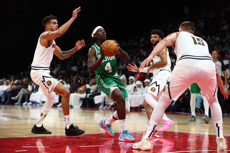 ABU DHABI, UNITED ARAB EMIRATES - OCTOBER 04: Jrue Holiday of Boston Celtics controls the ball during the NBA match between Denver Nuggets and Boston Celtics at Etihad Arena on October 04, 2024 in Abu Dhabi, United Arab Emirates.  (Photo by Francois Nel/Getty Images)