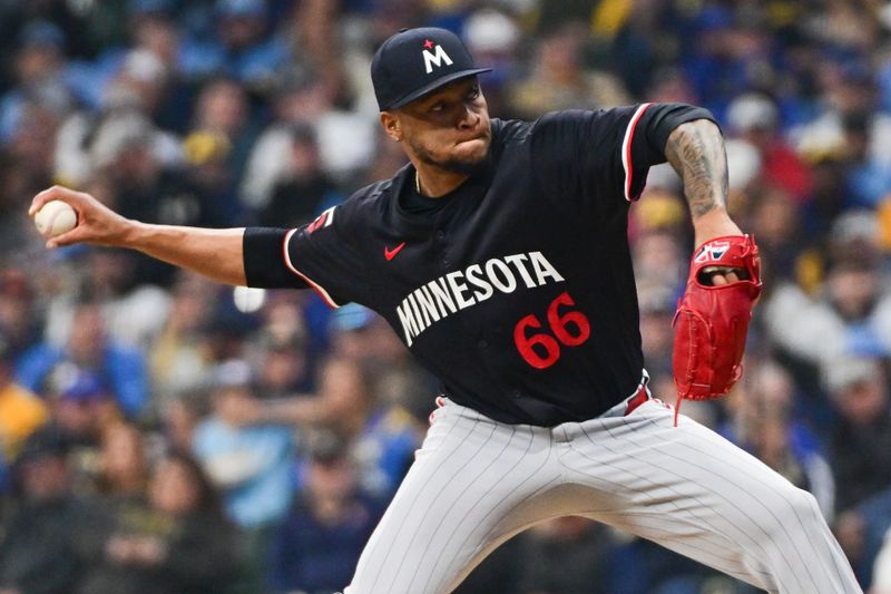 Apr 2, 2024; Milwaukee, Wisconsin, USA;  Minnesota Twins pitcher Jorge Alcala (66) pitches against the Milwaukee Brewers in the sixth inning at American Family Field. Mandatory Credit: Benny Sieu-USA TODAY Sports