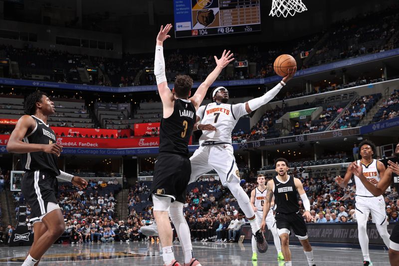 MEMPHIS, TN - APRIL 14: Reggie Jackson #7 of the Denver Nuggets drives to the basket during the game against the Memphis Grizzlies on April 14, 2024 at FedExForum in Memphis, Tennessee. NOTE TO USER: User expressly acknowledges and agrees that, by downloading and or using this photograph, User is consenting to the terms and conditions of the Getty Images License Agreement. Mandatory Copyright Notice: Copyright 2024 NBAE (Photo by Joe Murphy/NBAE via Getty Images)