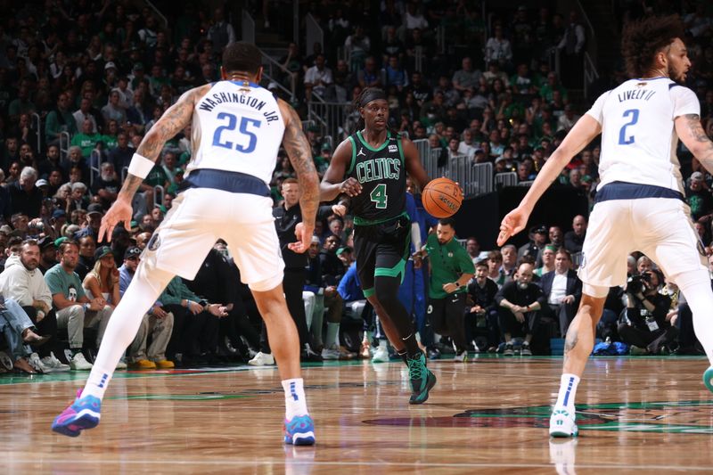 BOSTON, MA - JUNE 9: Jrue Holiday #4 of the Boston Celtics dribbles the ball during the game against the Dallas Mavericks during Game 1 of the 2024 NBA Finals on June 9, 2024 at the TD Garden in Boston, Massachusetts. NOTE TO USER: User expressly acknowledges and agrees that, by downloading and or using this photograph, User is consenting to the terms and conditions of the Getty Images License Agreement. Mandatory Copyright Notice: Copyright 2024 NBAE  (Photo by Nathaniel S. Butler/NBAE via Getty Images)