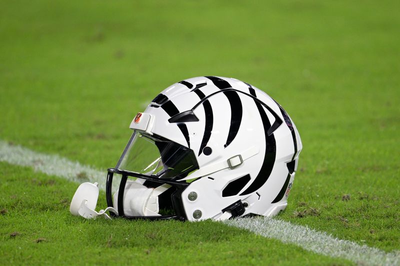 A Cincinnati Bengals helmet is viewed on the field before an NFL football game against the Jacksonville Jaguars, Monday, Dec. 4, 2023, in Jacksonville, Fla. (AP Photo/Phelan M. Ebenhack)