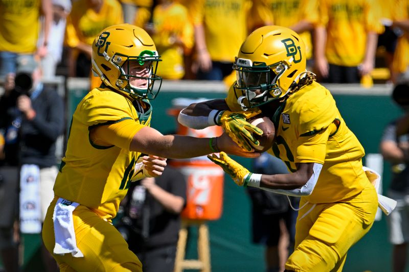 Oct 1, 2022; Waco, Texas, USA; Baylor Bears quarterback Blake Shapen (12) hands off to running back Craig Williams (0) during the first quarter at McLane Stadium. Mandatory Credit: Jerome Miron-USA TODAY Sports