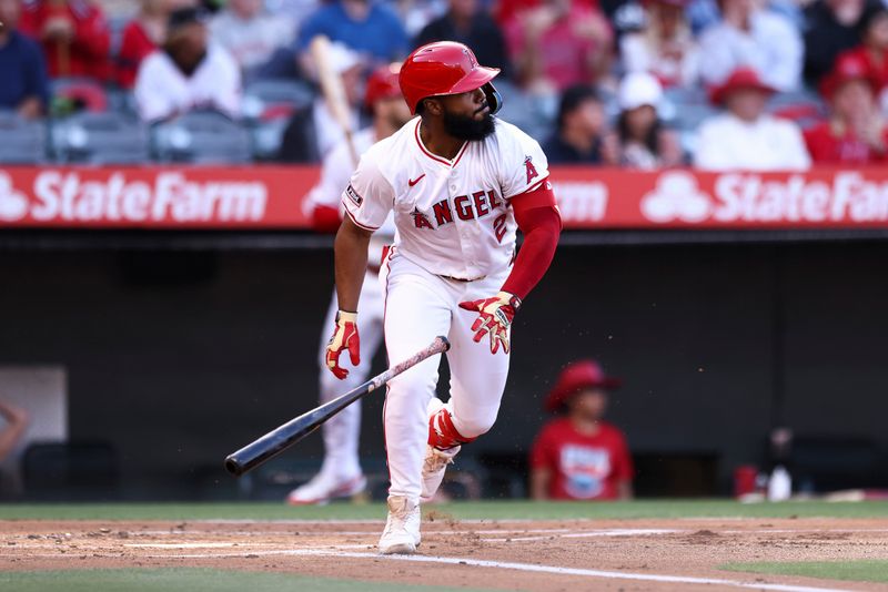 May 24, 2024; Anaheim, California, USA; Los Angeles Angels second base Luis Rengifo (2) drops the bat after hitting a home run against the Cleveland Guardians during the first inning of a game at Angel Stadium. Mandatory Credit: Jessica Alcheh-USA TODAY Sports