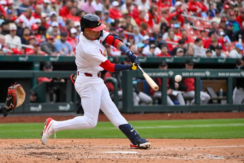 May 25, 2025; St. Louis, Missouri, USA;  St. Louis Cardinals shortstop Masyn Winn (0) hits a solo home run against the Arizona Diamondbacks during the third inning at Busch Stadium. Mandatory Credit: Jeff Curry-Imagn Images