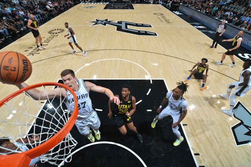 SAN ANTONIO, TX - OCTOBER 12: Riley Minix #27 of the San Antonio Spurs shoots the ball during the game against the Utah Jazz  during a NBA pre season game on October 12, 2024 at the Frost Bank Center in San Antonio, Texas. NOTE TO USER: User expressly acknowledges and agrees that, by downloading and or using this photograph, user is consenting to the terms and conditions of the Getty Images License Agreement. Mandatory Copyright Notice: Copyright 2024 NBAE (Photos by Michael Gonzales/NBAE via Getty Images)