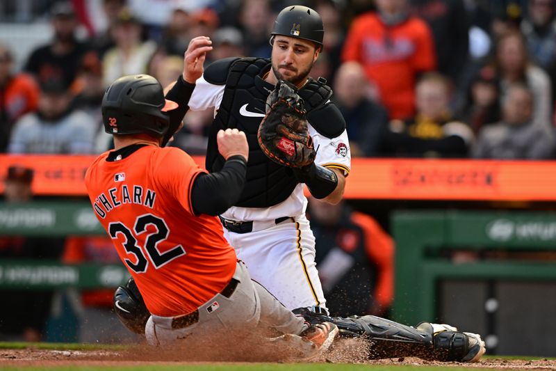 Apr 6, 2024; Pittsburgh, Pennsylvania, USA; Pittsburgh Pirates catcher Joey Bart (14) tags out Baltimore Orioles first base Ryan O'Hearn (32) during the ninth inning at PNC Park. Mandatory Credit: David Dermer-USA TODAY Sports