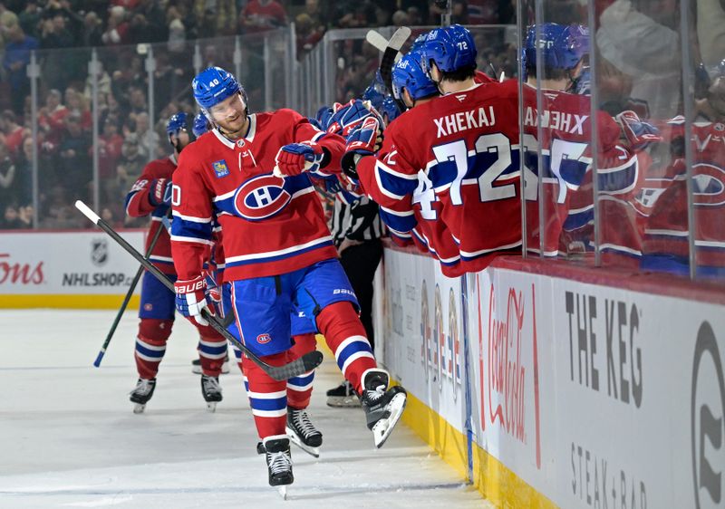 Nov 5, 2024; Montreal, Quebec, CAN; Montreal Canadiens forward Joel Armia (40) celebrates with teammates after scoring a goal against the Calgary Flames during the third period at the Bell Centre. Mandatory Credit: Eric Bolte-Imagn Images