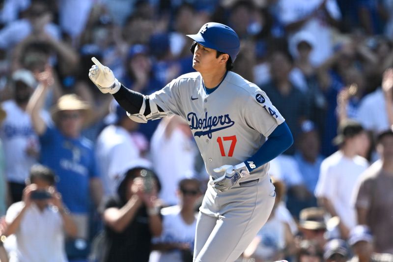 Aug 24, 2025; San Diego, California, USA; Los Angeles Dodgers designated hitter Shohei Ohtani (17) rounds the bases after hitting a solo home run during the ninth inning against the San Diego Padres at Petco Park. Mandatory Credit: Denis Poroy-Imagn Images
