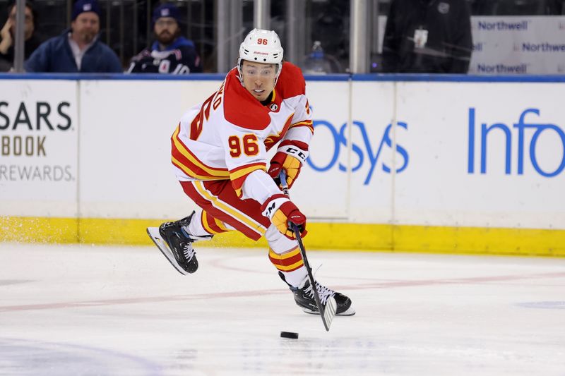 Feb 12, 2024; New York, New York, USA; Calgary Flames left wing Andrei Kuzmenko (96) plays the puck against the New York Rangers during the second period at Madison Square Garden. Mandatory Credit: Brad Penner-USA TODAY Sports