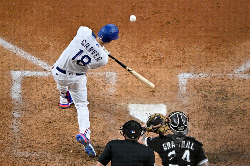 Aug 3, 2023; Arlington, Texas, USA; Texas Rangers catcher Mitch Garver (18) bats against the Chicago White Sox during the sixth inning at Globe Life Field. Mandatory Credit: Jerome Miron-USA TODAY Sports