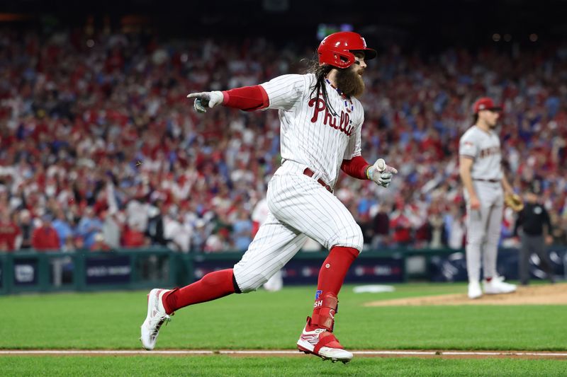 Oct 24, 2023; Philadelphia, Pennsylvania, USA; Philadelphia Phillies center fielder Brandon Marsh (16) reacts after hitting a single in the third inning for game seven of the NLCS for the 2023 MLB playoffs at Citizens Bank Park. Mandatory Credit: Bill Streicher-USA TODAY Sports