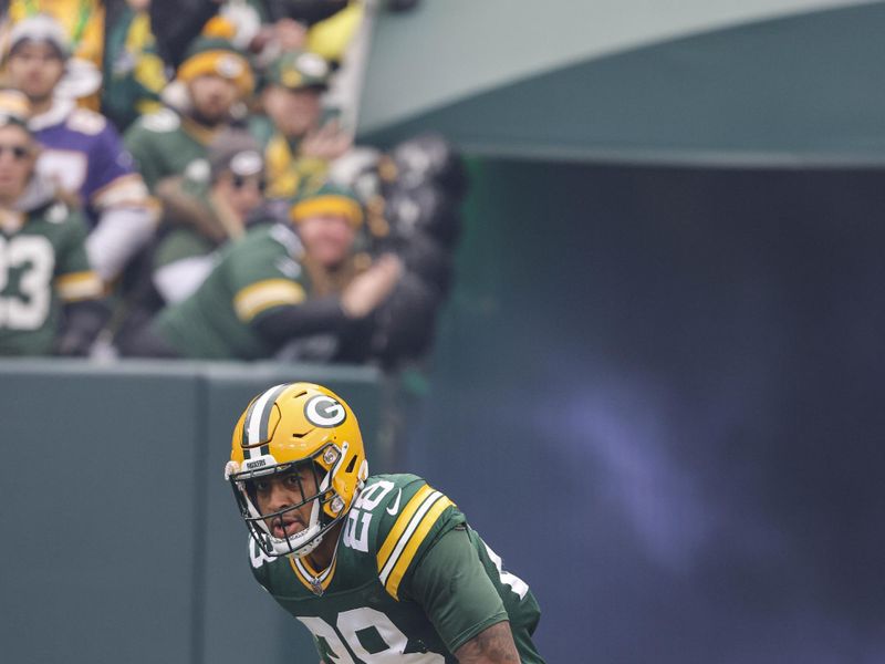 Green Bay Packers running back AJ Dillon (28) is introduced before an NFL football game between the Minnesota Vikings and Green Bay Packers Sunday, Oct. 29, 2023, in Green Bay, Wis. (AP Photo/Jeffrey Phelps)