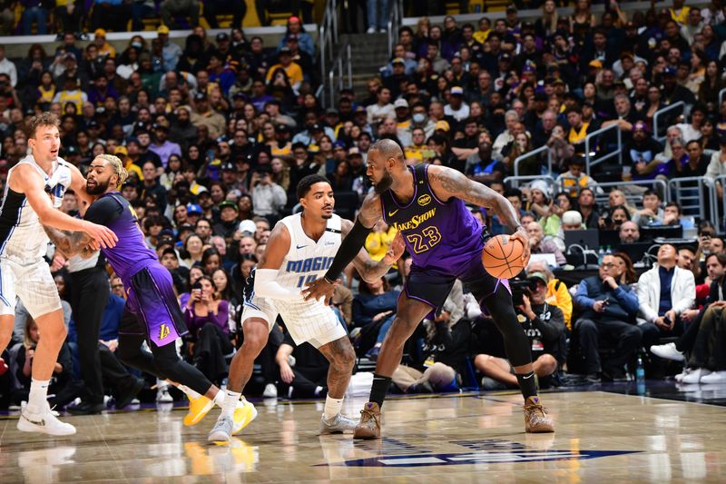 LOS ANGELES, CA - NOVEMBER 21:  LeBron James #23 of the Los Angeles Lakers dribbles the ball during the game against the Orlando Magic on November 21, 2024 at Crypto.Com Arena in Los Angeles, California. NOTE TO USER: User expressly acknowledges and agrees that, by downloading and/or using this Photograph, user is consenting to the terms and conditions of the Getty Images License Agreement. Mandatory Copyright Notice: Copyright 2024 NBAE (Photo by Adam Pantozzi/NBAE via Getty Images)