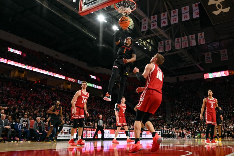 Jan 25, 2023; College Park, Maryland, USA;  Maryland Terrapins guard Jahmir Young (1) dunks over Wisconsin Badgers guard Isaac Lindsey (10) during the second half at Xfinity Center. Mandatory Credit: Tommy Gilligan-USA TODAY Sports