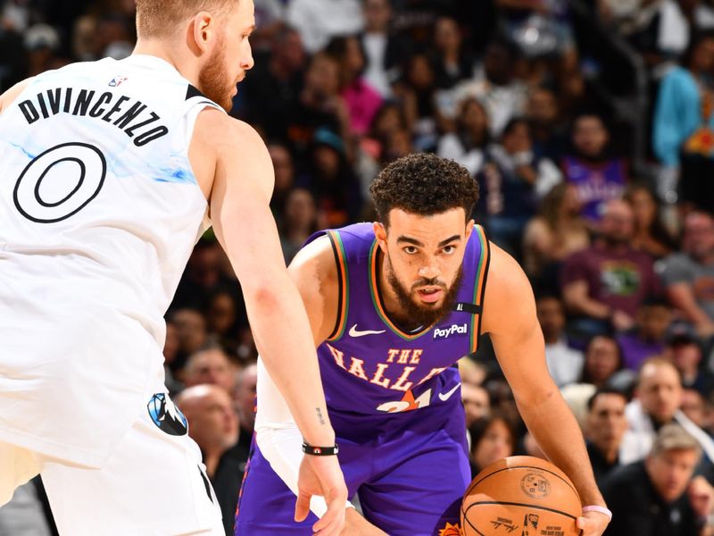 PHOENIX, AZ - MARCH 2:  Tyus Jones #21 of the Phoenix Suns dribbles the ball during the game against the Minnesota Timberwolves on March 2, 2025 at PHX Arena in Phoenix, Arizona. NOTE TO USER: User expressly acknowledges and agrees that, by downloading and or using this photograph, user is consenting to the terms and conditions of the Getty Images License Agreement. Mandatory Copyright Notice: Copyright 2025 NBAE (Photo by Barry Gossage/NBAE via Getty Images)