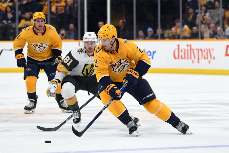 Mar 26, 2024; Nashville, Tennessee, USA; Nashville Predators defenseman Luke Schenn (2) skates with the puck against Vegas Golden Knights right wing Jonathan Marchessault (81) during the second period at Bridgestone Arena. Mandatory Credit: Christopher Hanewinckel-USA TODAY Sports