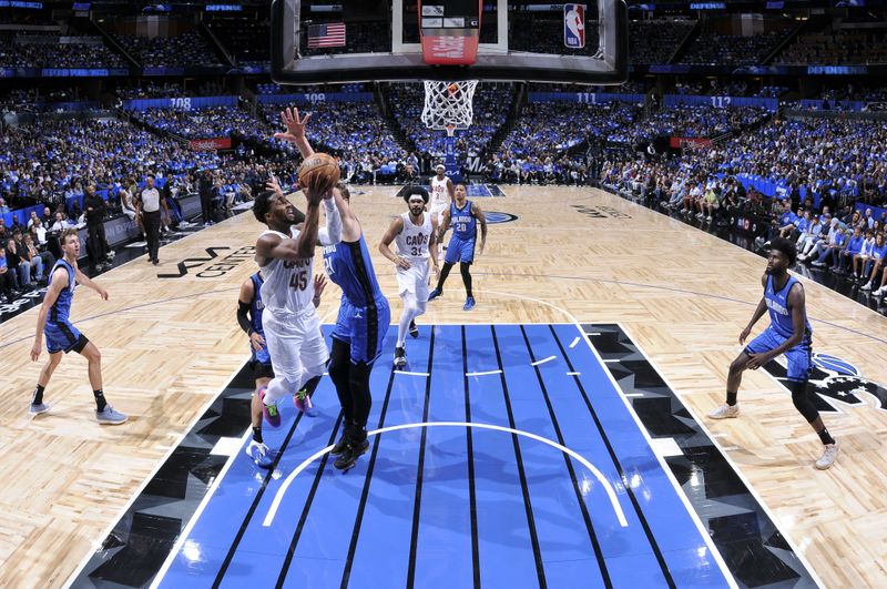 ORLANDO, FL - APRIL 27: Donovan Mitchell #45 of the Cleveland Cavaliers drives to the basket during the game against the Orlando Magic during Round 1 Game 4 of the 2024 NBA Playoffs on April 27, 2024 at the Kia Center in Orlando, Florida. NOTE TO USER: User expressly acknowledges and agrees that, by downloading and or using this photograph, User is consenting to the terms and conditions of the Getty Images License Agreement. Mandatory Copyright Notice: Copyright 2024 NBAE (Photo by Fernando Medina/NBAE via Getty Images)