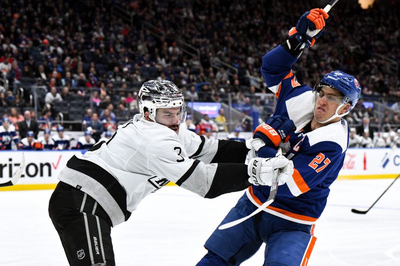 Dec 9, 2023; Elmont, New York, USA; Los Angeles Kings defenseman Matt Roy (3) fights for the puck against New York Islanders left wing Anders Lee (27) during the second period at UBS Arena. Mandatory Credit: John Jones-USA TODAY Sports