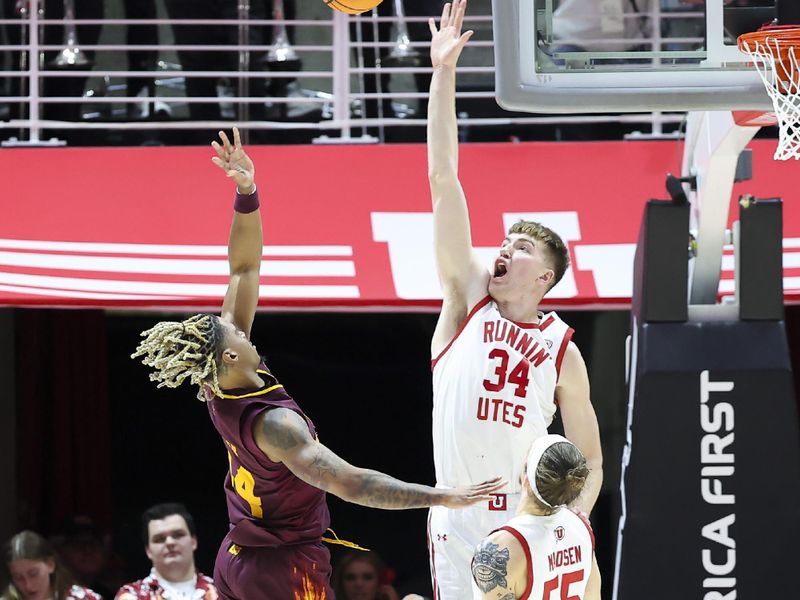 Feb 10, 2024; Salt Lake City, Utah, USA; Arizona State Sun Devils guard Adam Miller (44) shoots over Utah Utes center Lawson Lovering (34) and guard Gabe Madsen (55) during the second half at Jon M. Huntsman Center. Mandatory Credit: Rob Gray-USA TODAY Sports