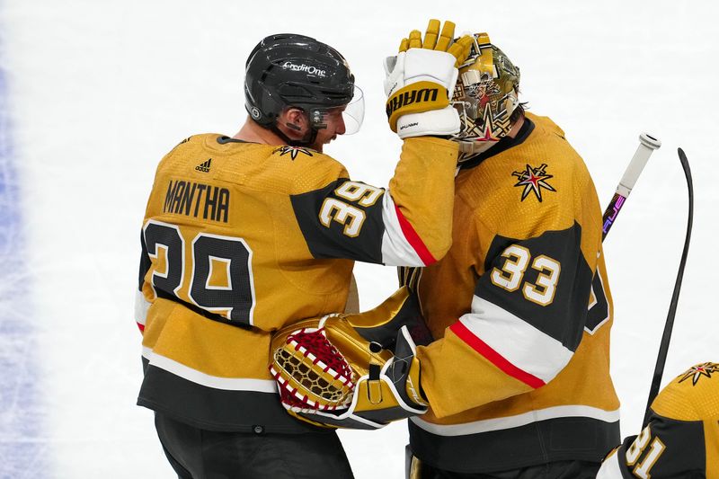 Apr 14, 2024; Las Vegas, Nevada, USA; Vegas Golden Knights right wing Anthony Mantha (39) celebrates with goaltender Adin Hill (33) after defeating the Colorado Avalanche 4-3 in overtime at T-Mobile Arena. Mandatory Credit: Stephen R. Sylvanie-USA TODAY Sports