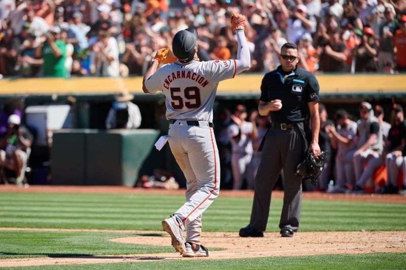 Aug 18, 2024; Oakland, California, USA; San Francisco Giants outfielder Jerar Encarnacion (59) reacts as he scores a run after hitting a two-run home run against the Oakland Athletics during the tenth inning at Oakland-Alameda County Coliseum. Mandatory Credit: Robert Edwards-USA TODAY Sports