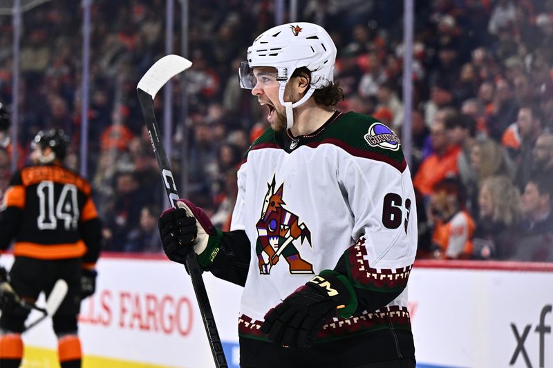 Feb 12, 2024; Philadelphia, Pennsylvania, USA; Arizona Coyotes left wing Matias Maccelli (63) reacts after scoring a goal against the Philadelphia Flyers in the second period at Wells Fargo Center. Mandatory Credit: Kyle Ross-USA TODAY Sports