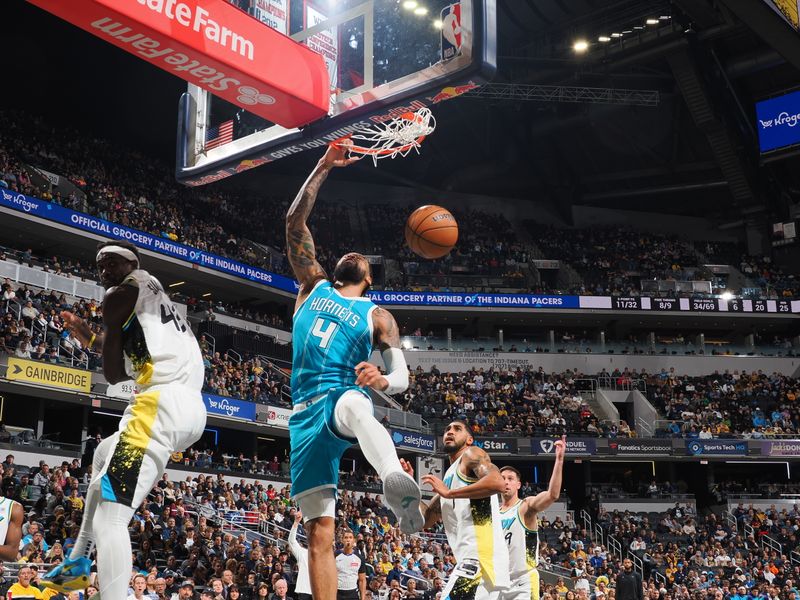 INDIANAPOLIS, IN - DECEMBER 8: Nick Richards #4 of the Charlotte Hornets dunks the ball during the game against the Indiana Pacers on December 8, 2024 at Gainbridge Fieldhouse in Indianapolis, Indiana. NOTE TO USER: User expressly acknowledges and agrees that, by downloading and or using this Photograph, user is consenting to the terms and conditions of the Getty Images License Agreement. Mandatory Copyright Notice: Copyright 2024 NBAE (Photo by Ron Hoskins/NBAE via Getty Images)