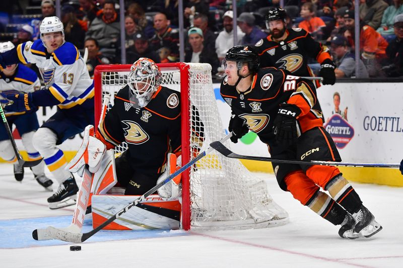 Apr 7, 2024; Anaheim, California, USA; Anaheim Ducks center Ben Meyers (39) moves the puck as goaltender Lukas Dostal (1) defends the goal against the St. Louis Blues during the third period at Honda Center. Mandatory Credit: Gary A. Vasquez-USA TODAY Sports