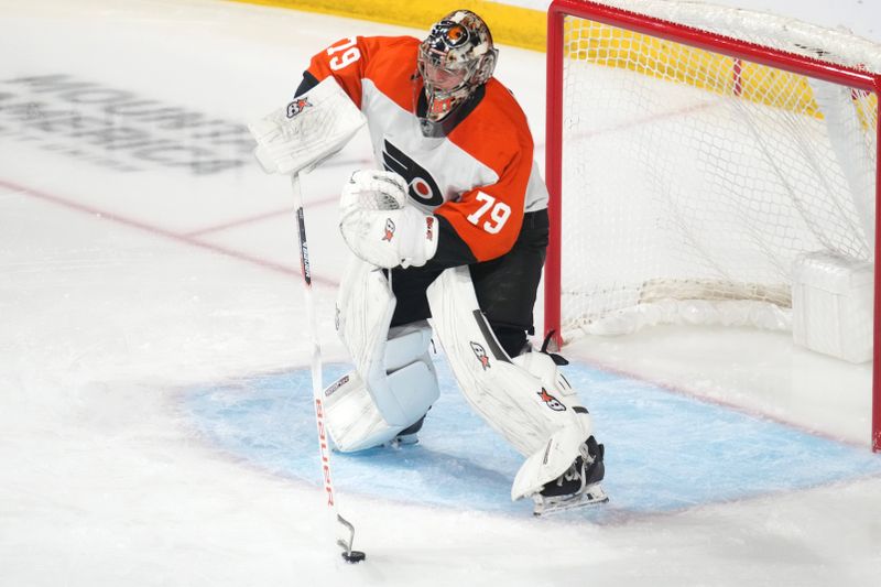 Dec 7, 2023; Tempe, Arizona, USA; Philadelphia Flyers goaltender Carter Hart (79) controls the puck against the Arizona Coyotes during the third period at Mullett Arena. Mandatory Credit: Joe Camporeale-USA TODAY Sports