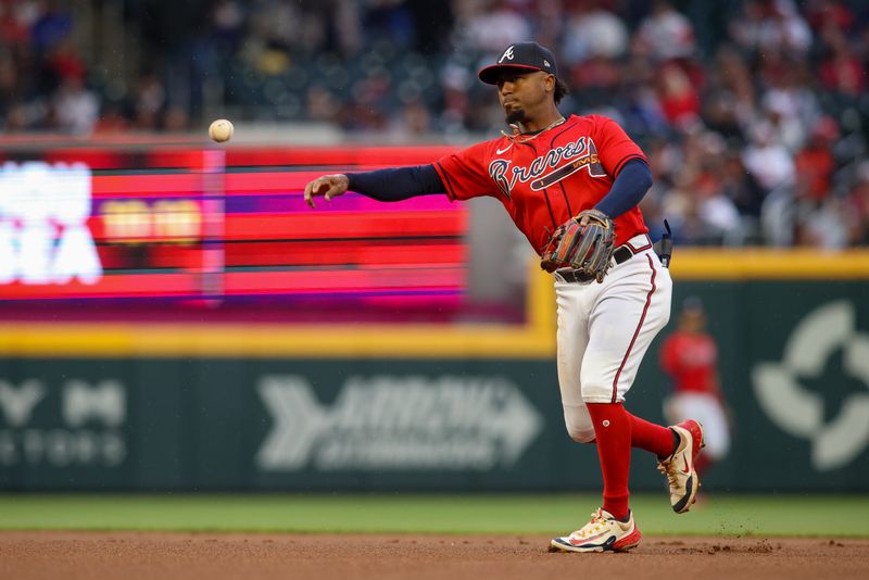 May 5, 2023; Atlanta, Georgia, USA; Atlanta Braves second baseman Ozzie Albies (1) throws a runner out at first against the Baltimore Orioles in the first inning at Truist Park. Mandatory Credit: Brett Davis-USA TODAY Sports