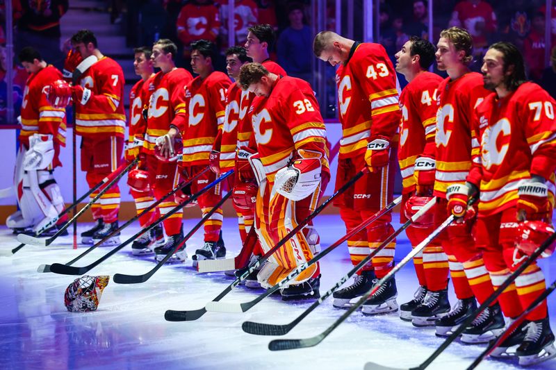 Oct 11, 2025; Calgary, Alberta, CAN; General view of the Calgary Flames players during the national anthem prior to the game against the St. Louis Blues at Scotiabank Saddledome. Mandatory Credit: Sergei Belski-Imagn Images