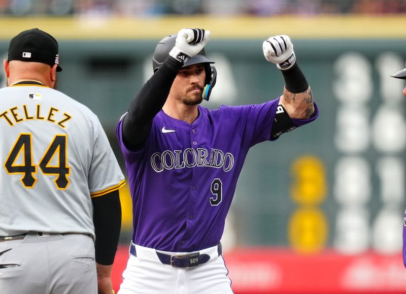 Jun 14, 2024; Denver, Colorado, USA; Colorado Rockies center fielder Brenton Doyle (9) celebrates his single in the first inning against the Pittsburgh Pirates at Coors Field. Mandatory Credit: Ron Chenoy-USA TODAY Sports