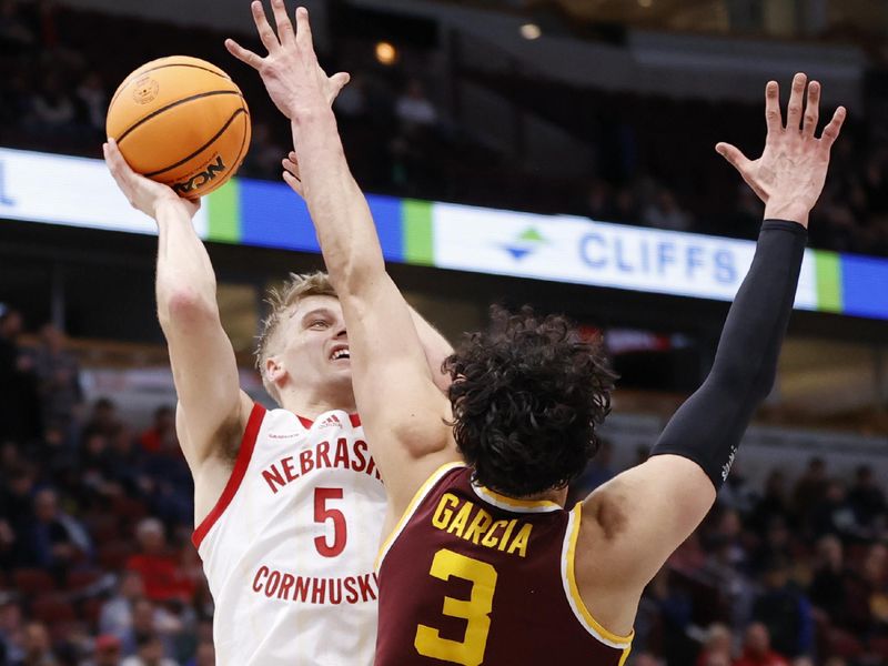 Mar 8, 2023; Chicago, IL, USA; Nebraska Cornhuskers guard Sam Griesel (5) shoots against Minnesota Golden Gophers forward Dawson Garcia (3) during the second half at United Center. Mandatory Credit: Kamil Krzaczynski-USA TODAY Sports