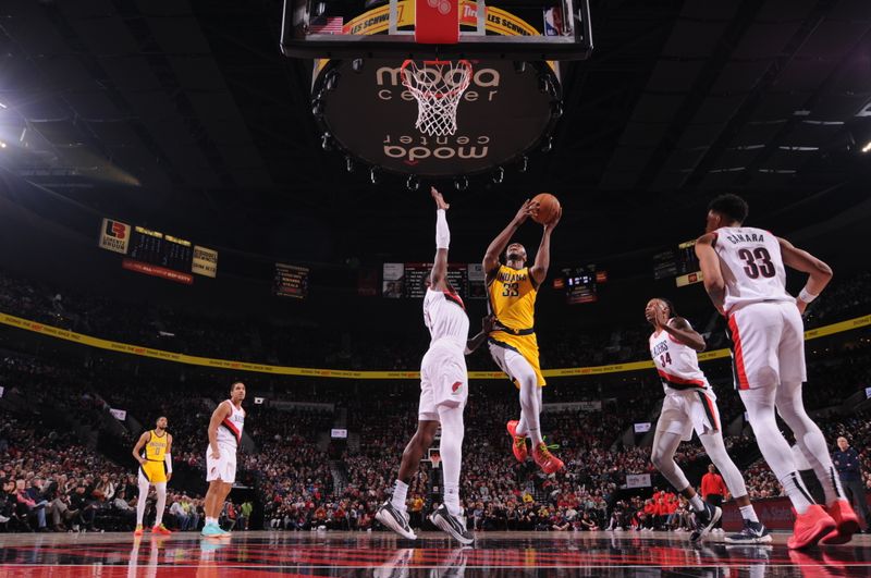 PORTLAND, OR - JANUARY 19: Myles Turner #33 of the Indiana Pacers drives to the basket during the game against the Portland Trail Blazers on January 19, 2024 at the Moda Center Arena in Portland, Oregon. NOTE TO USER: User expressly acknowledges and agrees that, by downloading and or using this photograph, user is consenting to the terms and conditions of the Getty Images License Agreement. Mandatory Copyright Notice: Copyright 2024 NBAE (Photo by Cameron Browne/NBAE via Getty Images)