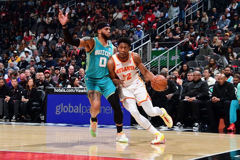 ATLANTA, GA - MARCH 23: De'Andre Hunter #12 of the Atlanta Hawks dribbles the ball during the game against the Charlotte Hornets on March 23, 2024 at State Farm Arena in Atlanta, Georgia.  NOTE TO USER: User expressly acknowledges and agrees that, by downloading and/or using this Photograph, user is consenting to the terms and conditions of the Getty Images License Agreement. Mandatory Copyright Notice: Copyright 2024 NBAE (Photo by Scott Cunningham/NBAE via Getty Images)