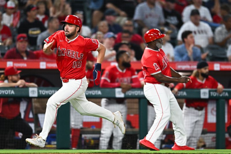 Aug 17, 2024; Anaheim, California, USA; Los Angeles Angels first baseman Nolan Schanuel (18) runs to home plate against the Atlanta Braves during the sixth inning at Angel Stadium. Mandatory Credit: Jonathan Hui-USA TODAY Sports